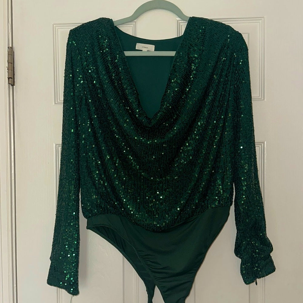 a loves a cowl neck long sleeve sequin emerald body suit.